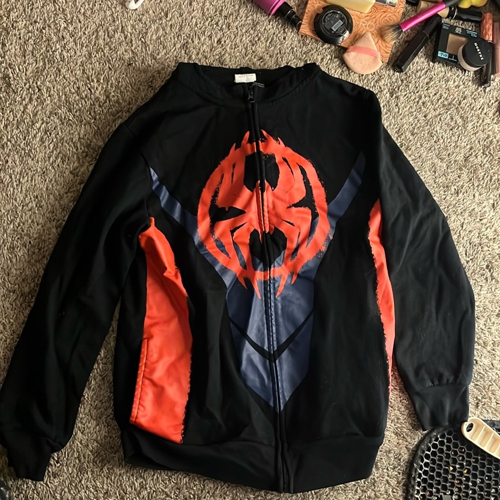 A spider man jacket it is black red and blue size XL